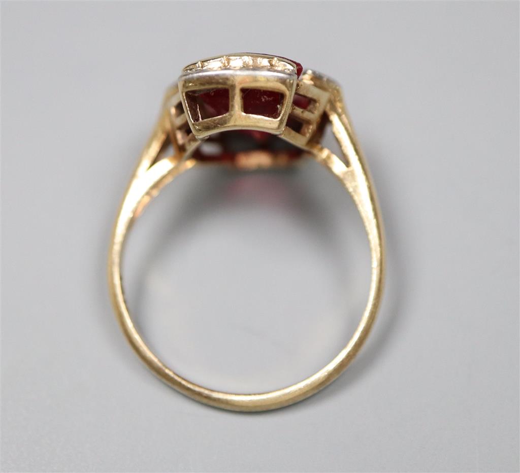 A 1950s? 10k yellow metal and fancy cut synthetic? ruby and diamond chip set dress ring, size L/M, gross 3.5 grams.